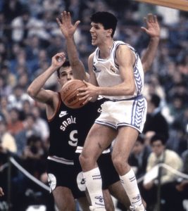 Drazen Petrovic in action with the jersey under the gaze of Oscar Smith. This 1989 game between Real Madrid and Snaidero Caserta is remembered as one of the best basketball games ever
