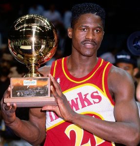 Dominique with the 1990 NBA Slam Dunk Contest trophy