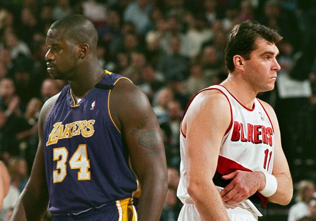 Shaquille O'Neal and Arvydas in a NBA game. Despite the injuries Arvydas got the respect from the NBA stars