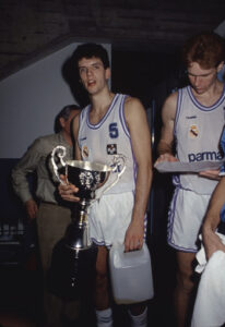 Months before Real Madrid and Barcelona played the Spanish King's Cup Championship Game. Petrovic scored 28 points and led Real Madrid to the title. Here an iconic picture for Coruña citizens: Petrovic with the Spanish King's Cup trophy under the Riazor stands
