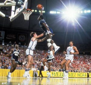 Patrick Ewing Sr playing for Georgetown too. Patrick Ewing Jr followed with the #33 tradition after his father or Alonzo Mourning