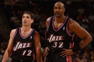 The Hall of Famers John Stockton and Karl Malone wearing the jersey