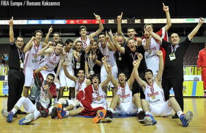 Osman wearing a similar jersey during the 2013 U18 Eurobasket Champion ceremony. This jersey was made for that championship but finally the style of the jersey changed in small details