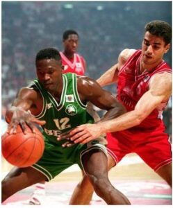 "Rambo" wearing a similar jersey while he is defending Dominique Wilkins