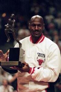 Michael Jordan wearing the white jacket while he receives the 1998 NBA Season MVP award