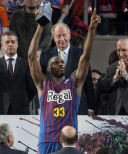 Mickeal wearing the jersey while he receives the 2013 Spanish King's Cup MVP trophy